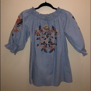 Blue flowers off the shoulders